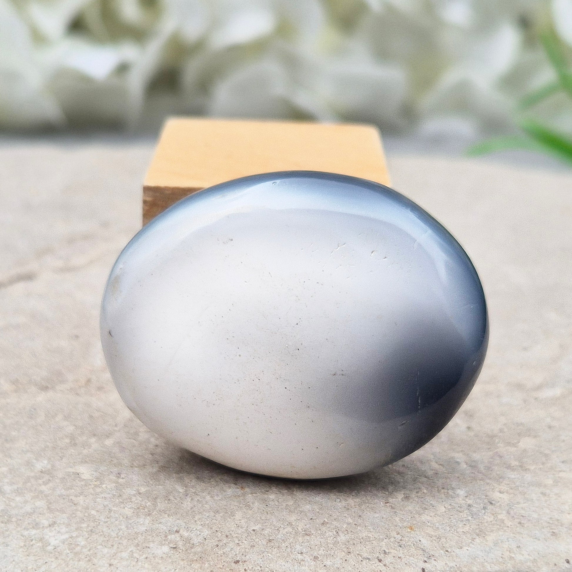 Orca Agate Crystal Pebble. This beautiful Orca Agate crystal, also known as Grey Agate, comes from Madagascar and is named after the Orca whale. It has striking dark grey and white patterning and colouring. 