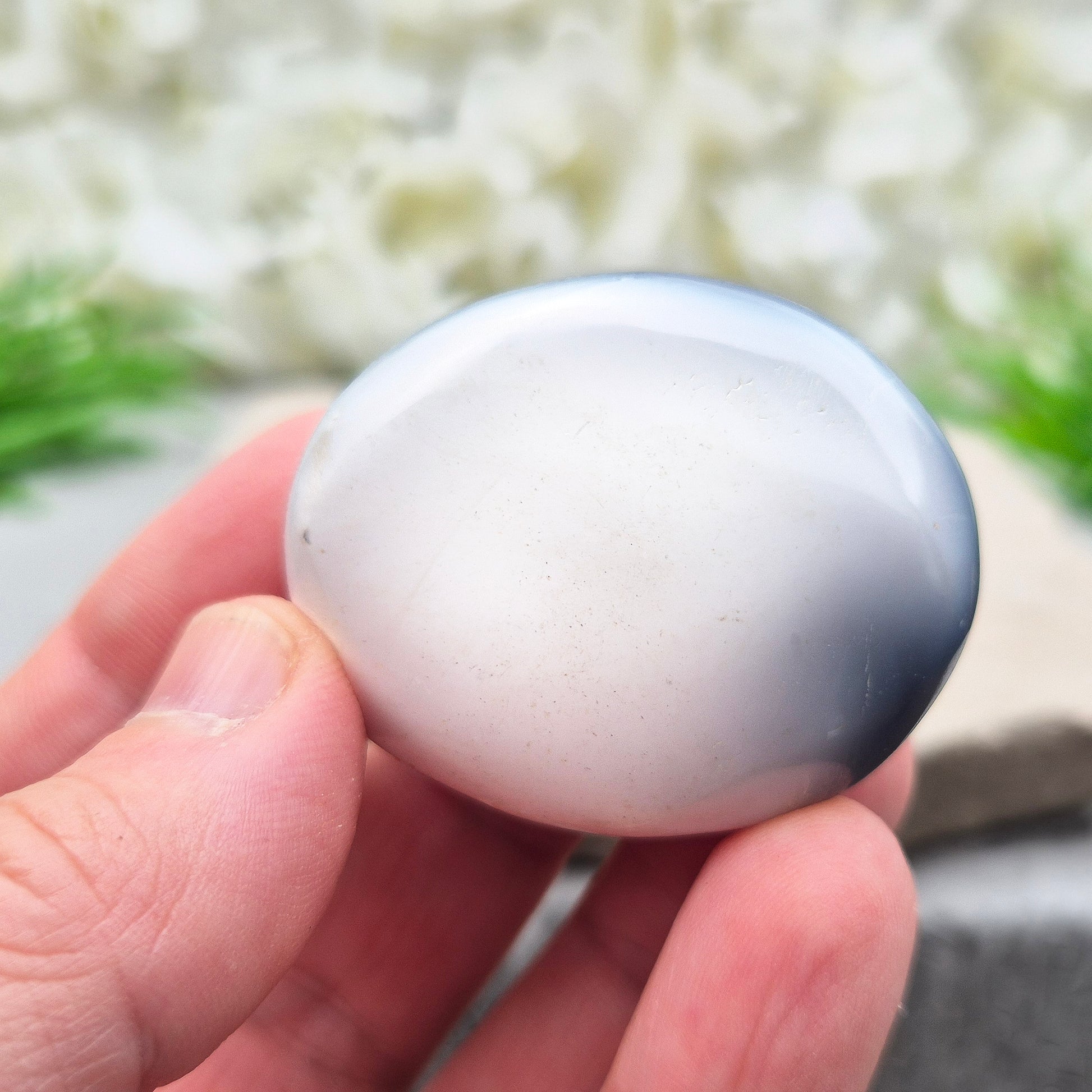 Orca Agate Crystal Pebble. This beautiful Orca Agate crystal, also known as Grey Agate, comes from Madagascar and is named after the Orca whale. It has striking dark grey and white patterning and colouring. 