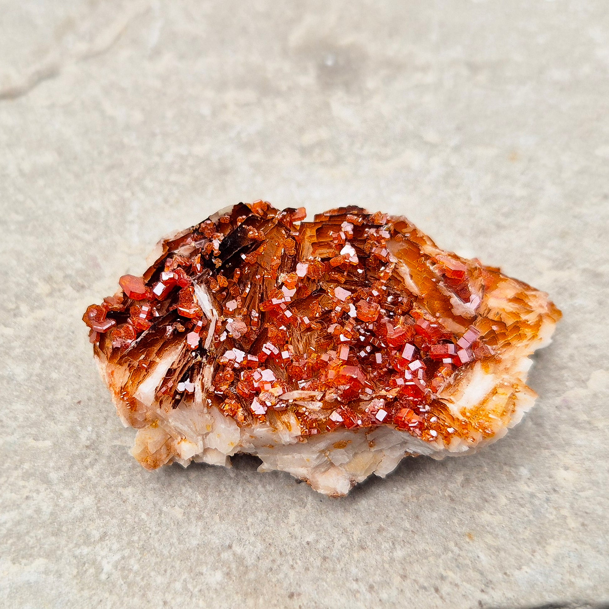 Vanadinite (Vanadite) Crystal Cluster. This vibrant Vanadinite crystal cluster from Morocco sparkles with fiery red-orange crystals naturally formed on their base matrix. 