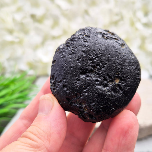 Natural Black Tektite — a protective, grounding crystal to support meditation, spiritual growth, and energetic balance.
