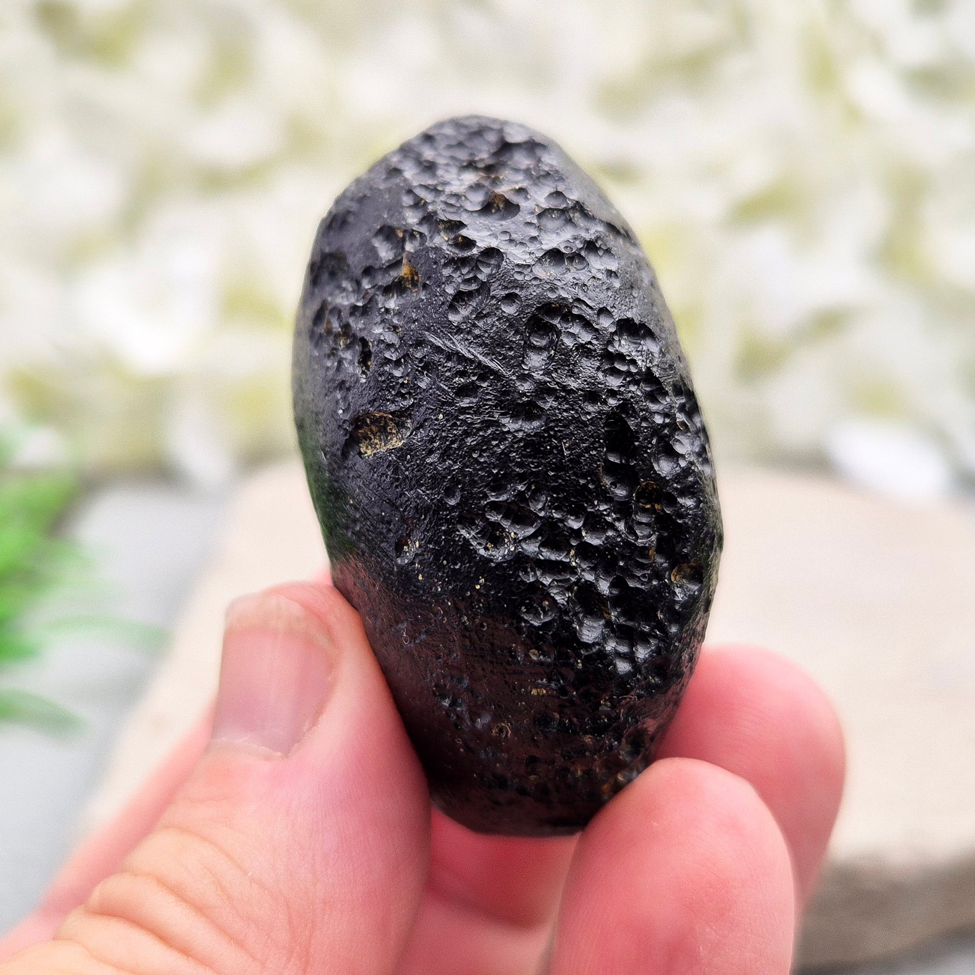 Natural Black Tektite — a protective, grounding crystal to support meditation, spiritual growth, and energetic balance.