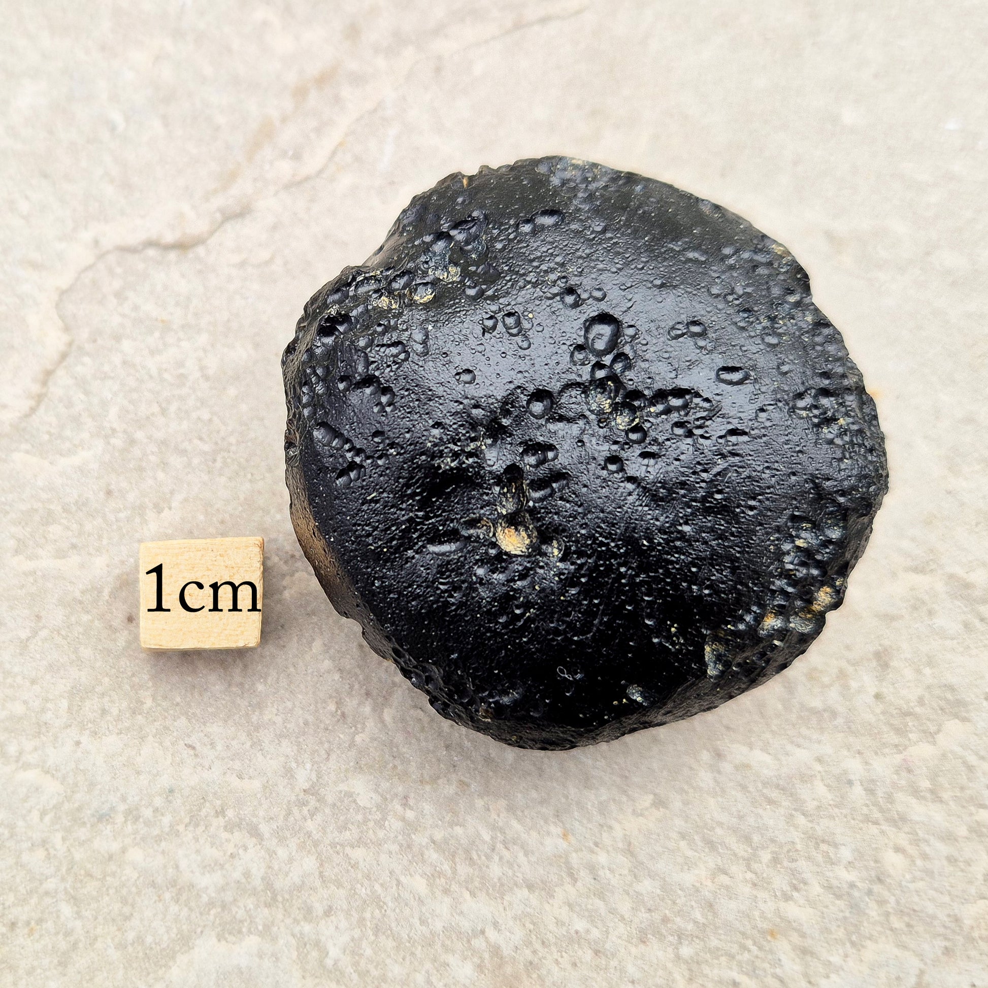 Natural Black Tektite — a protective, grounding crystal to support meditation, spiritual growth, and energetic balance.