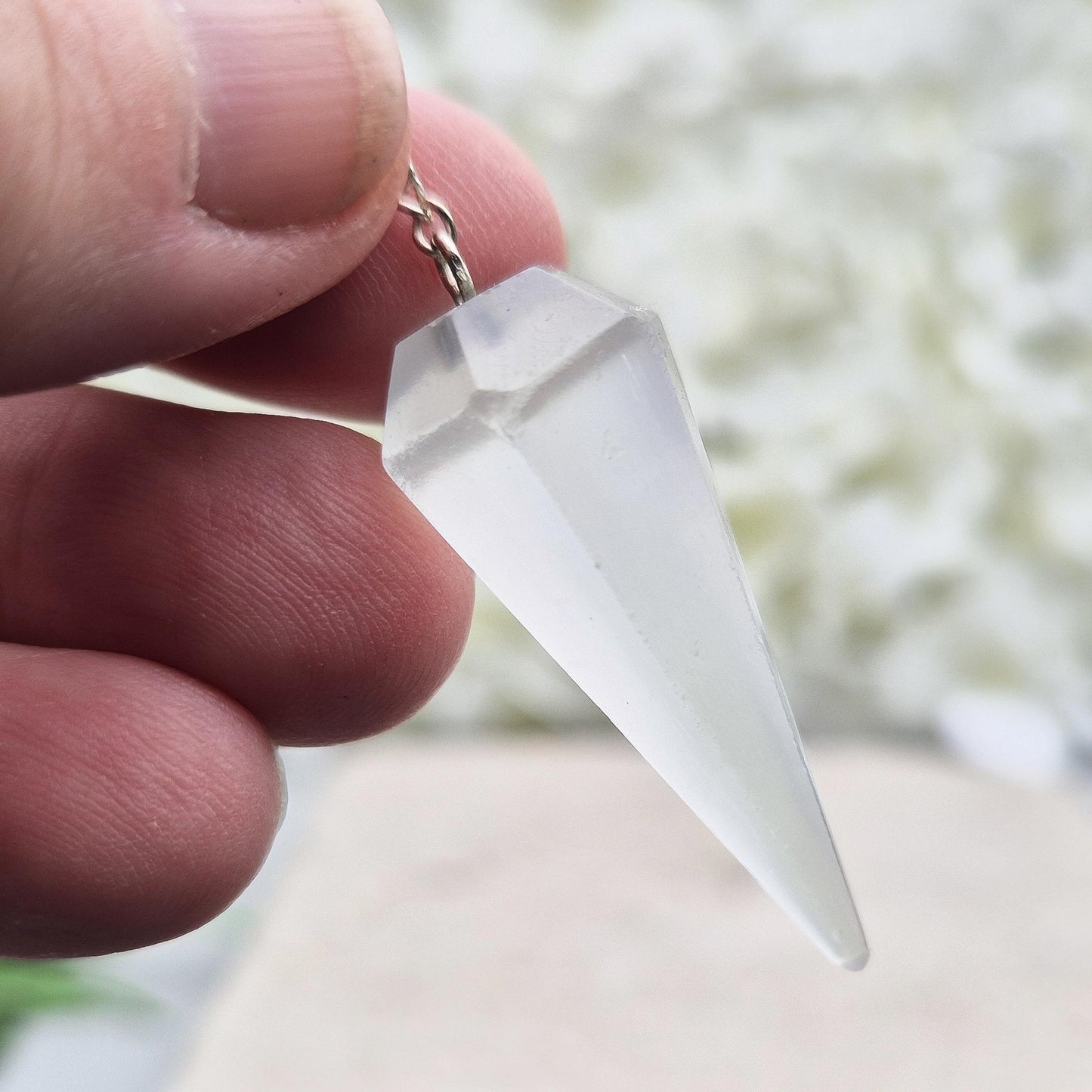 Selenite pendulum — a calming tool for dowsing, energy work, and meditation. Supports clarity and cleansing with gentle lunar energy. Enhance your divination.