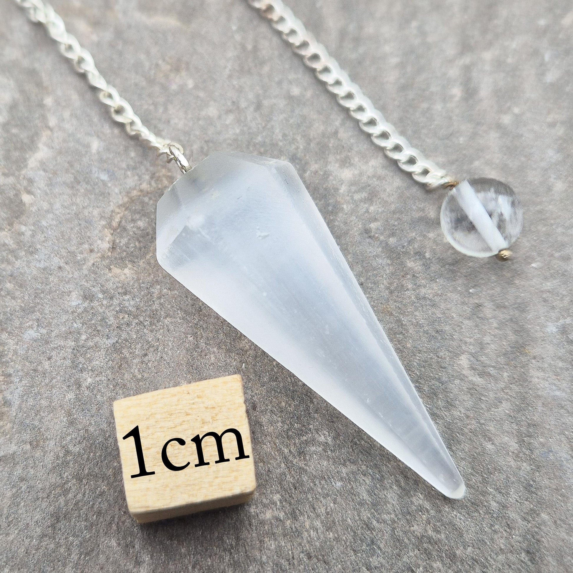 Selenite pendulum — a calming tool for dowsing, energy work, and meditation. Supports clarity and cleansing with gentle lunar energy. Enhance your divination.