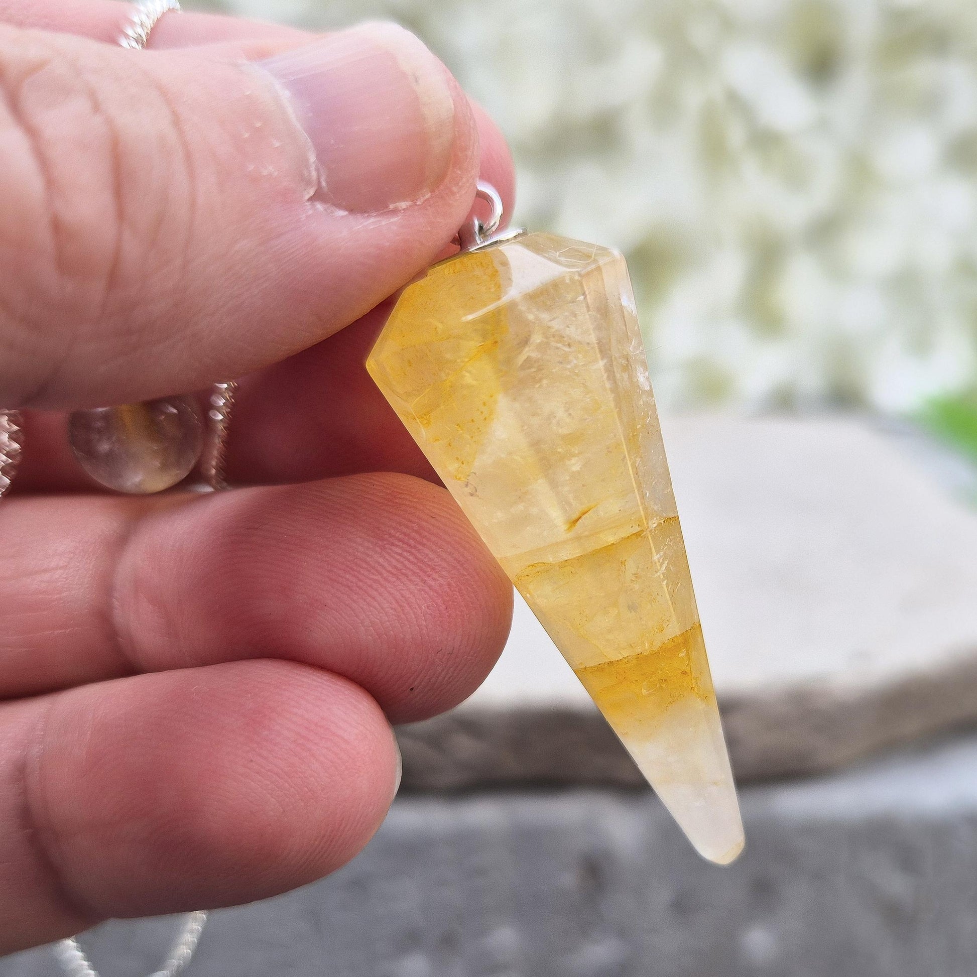 Golden Healer Quartz pendulum for energy work, dowsing, and intuitive guidance. Connects to gentle healing, balance, and spiritual growth.