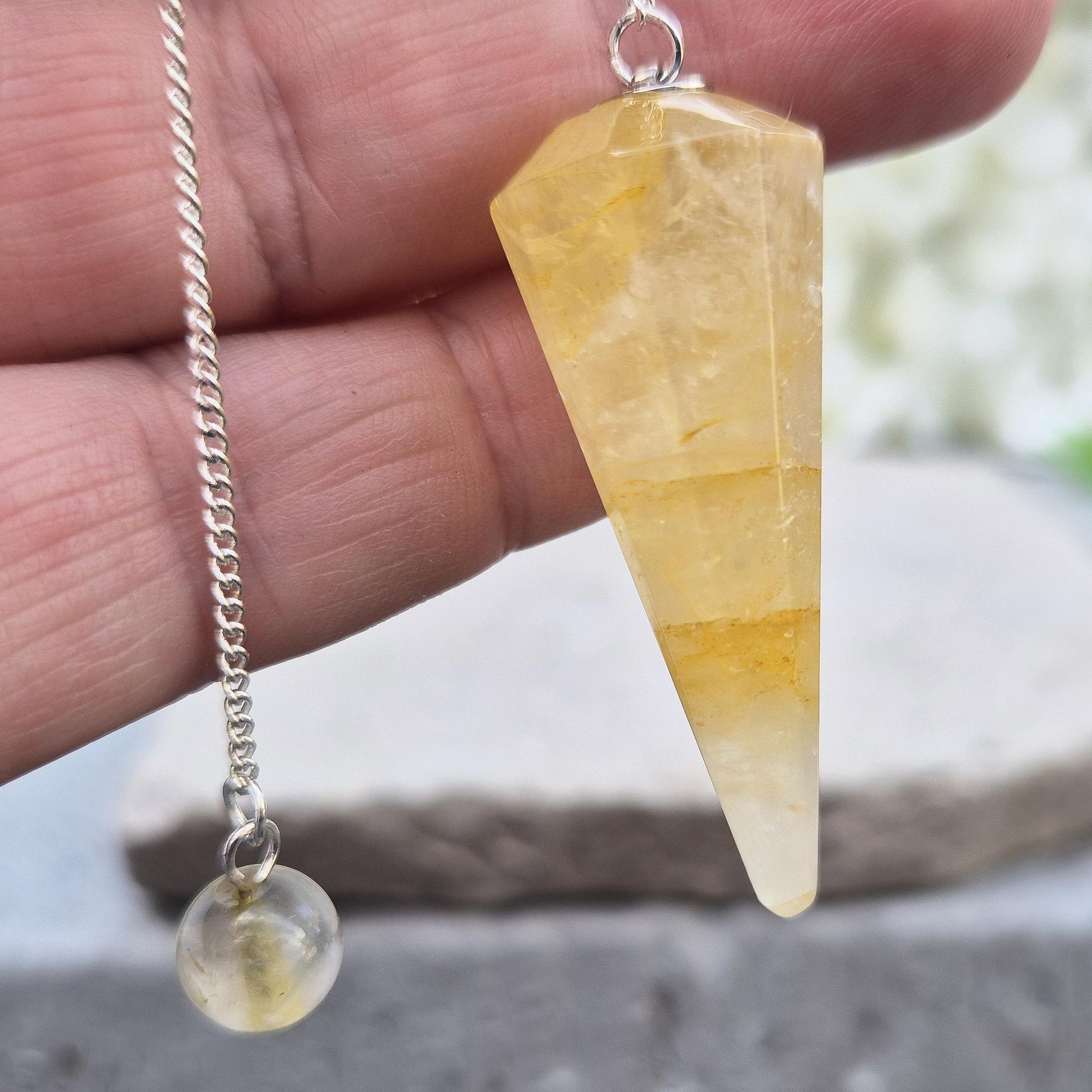 Golden Healer Quartz pendulum for energy work, dowsing, and intuitive guidance. Connects to gentle healing, balance, and spiritual growth.