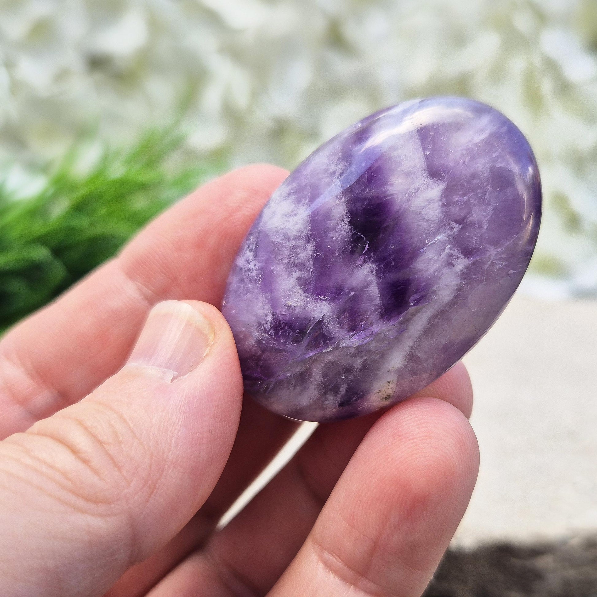Chevron Amethyst palm stone from Brazil. A soothing crystal that supports clarity, intuition, meditation, and emotional balance. 