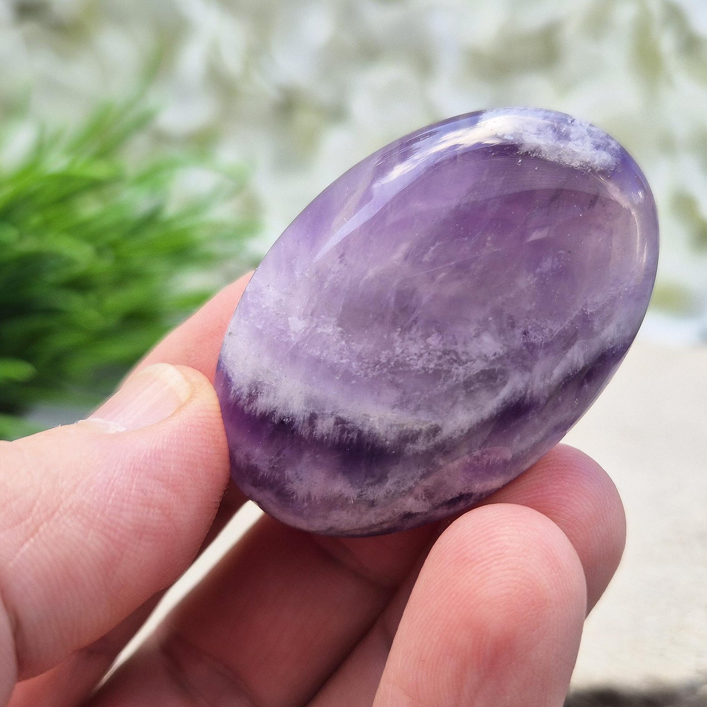 Chevron Amethyst palm stone from Brazil. A soothing crystal that supports clarity, intuition, meditation, and emotional balance. 