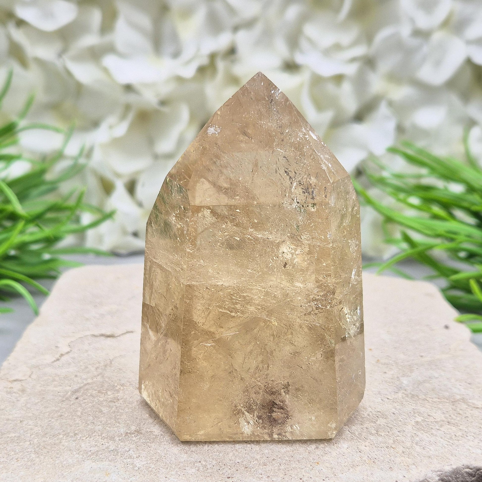 Natural polished citrine crystal point. A vibrant golden piece perfect for crystal displays, gifts, or home styling. Get rid of negative energy in your home!
