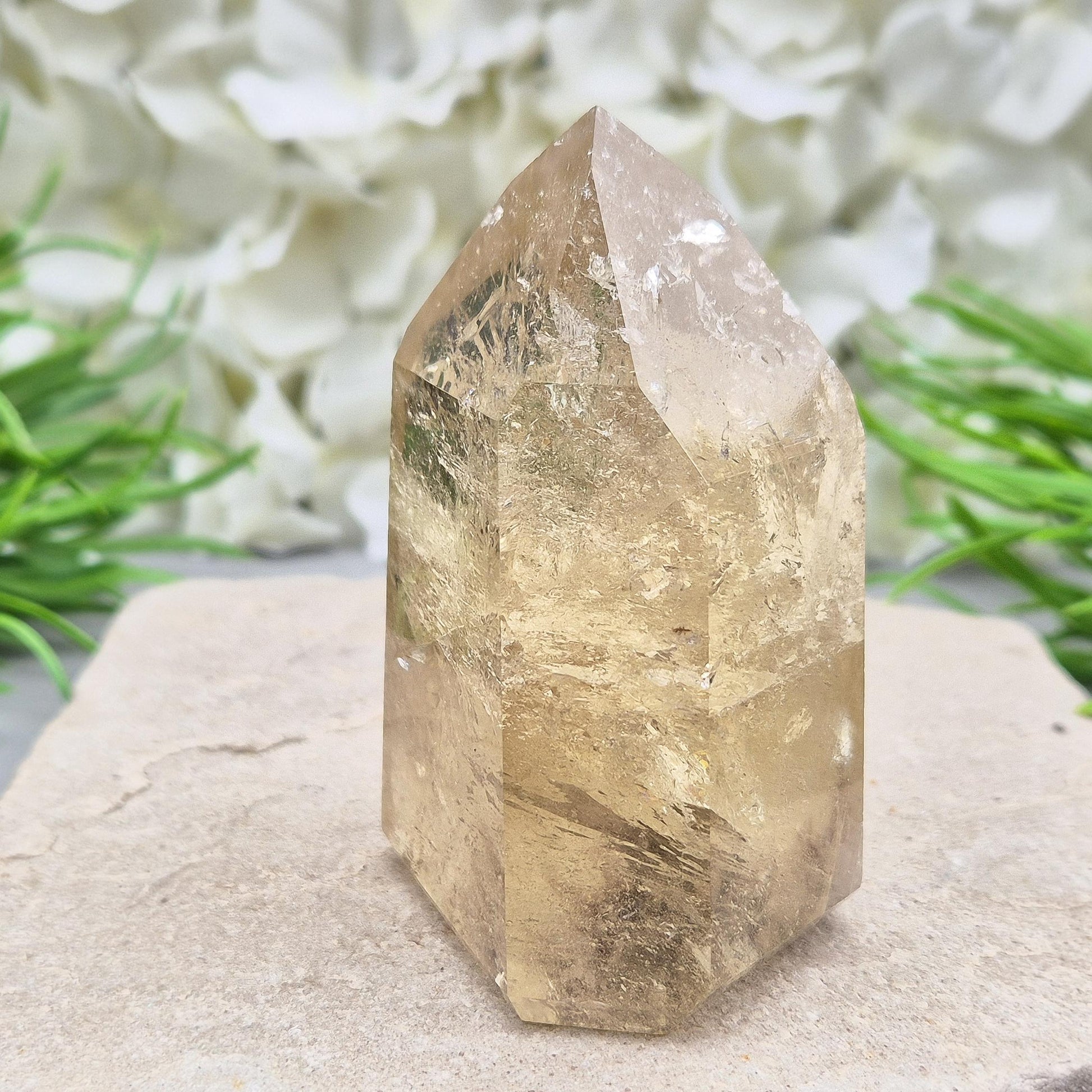Natural polished citrine crystal point. A vibrant golden piece perfect for crystal displays, gifts, or home styling. Get rid of negative energy in your home!