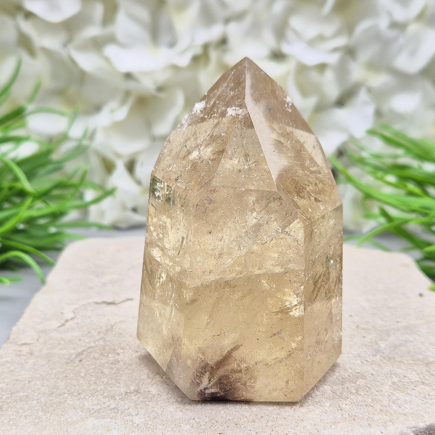 Natural polished citrine crystal point. A vibrant golden piece perfect for crystal displays, gifts, or home styling. Get rid of negative energy in your home!