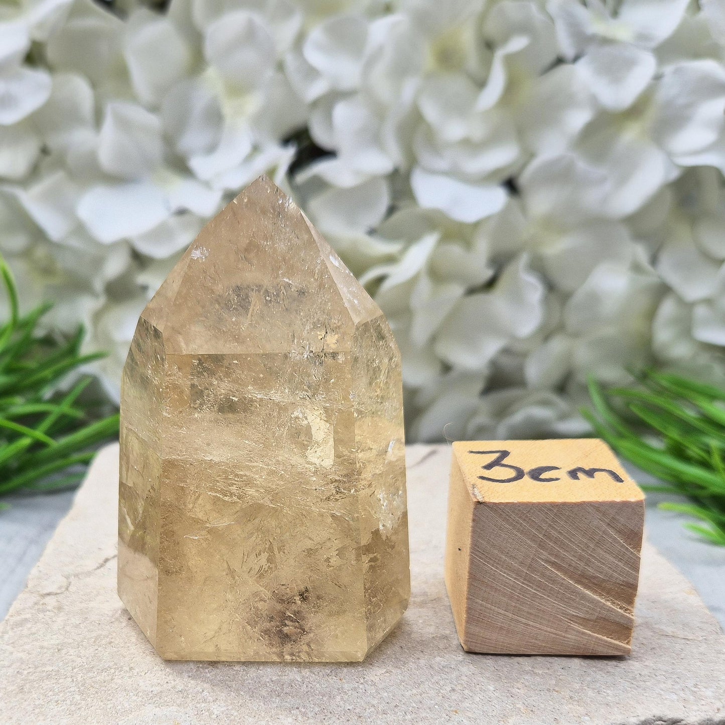 Natural polished citrine crystal point. A vibrant golden piece perfect for crystal displays, gifts, or home styling. Get rid of negative energy in your home!