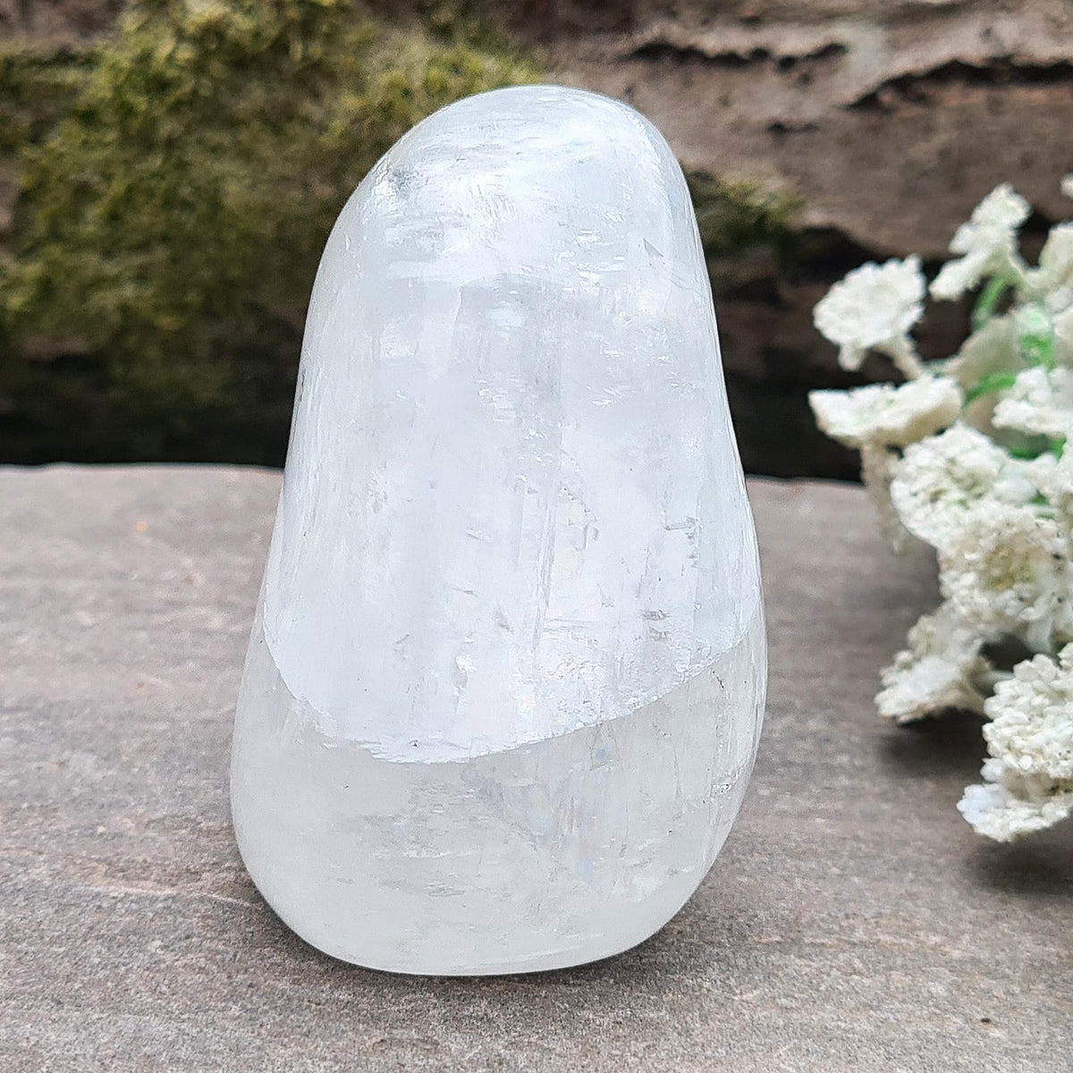 Elegant White Calcite freeform from Mexico with soft pearlescent lustre. Brings balance, motivation, and calm. Perfect for décor or meditation. 