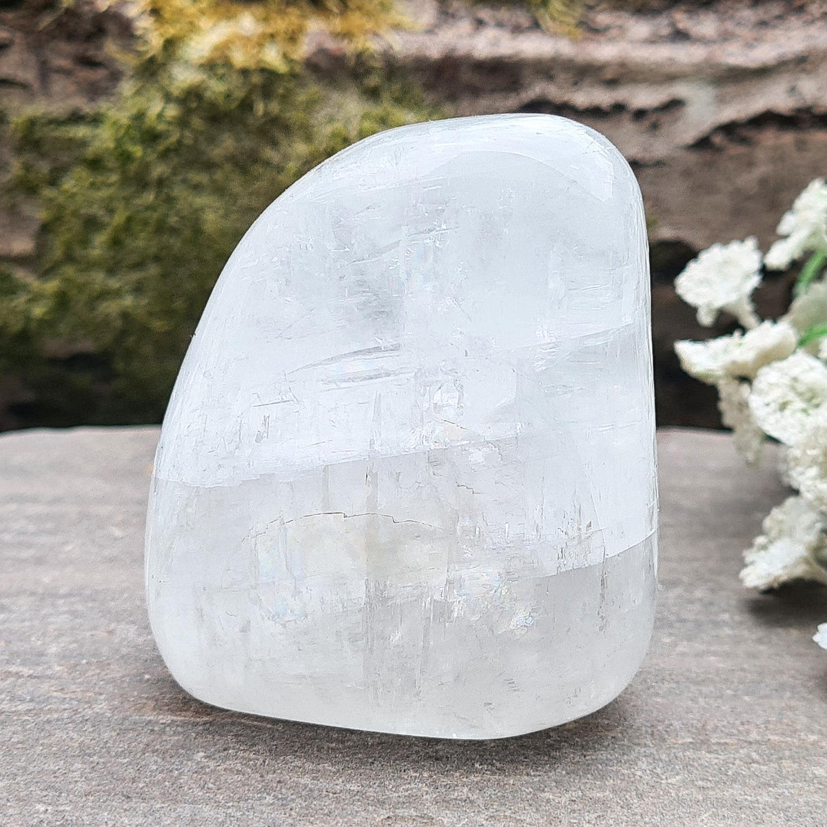 Elegant White Calcite freeform from Mexico with soft pearlescent lustre. Brings balance, motivation, and calm. Perfect for décor or meditation. 