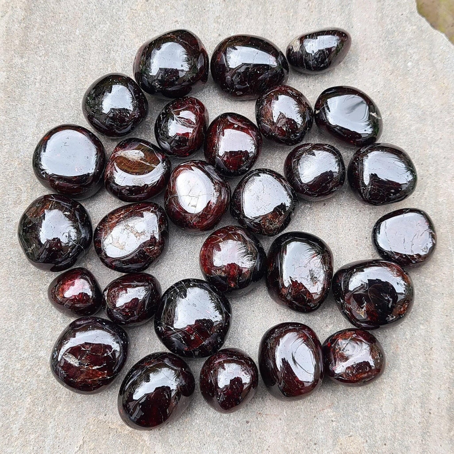 Shop polished Red Garnet crystals from India — deep redbtumbled stones, 8–15gm. Root chakra crystal for courage and motivation, love and passion.