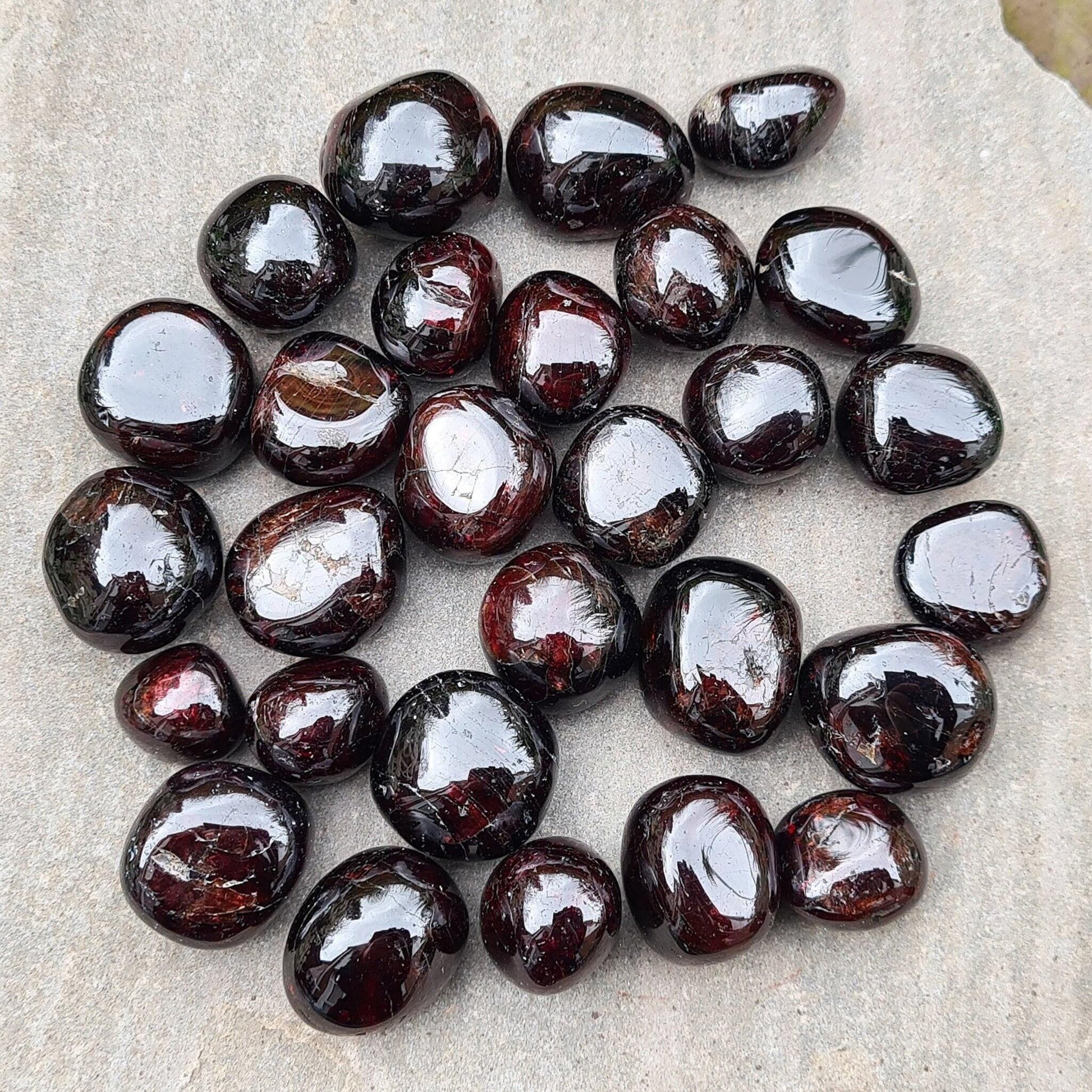 Shop polished Red Garnet crystals from India — deep redbtumbled stones, 8–15gm. Root chakra crystal for courage and motivation, love and passion.