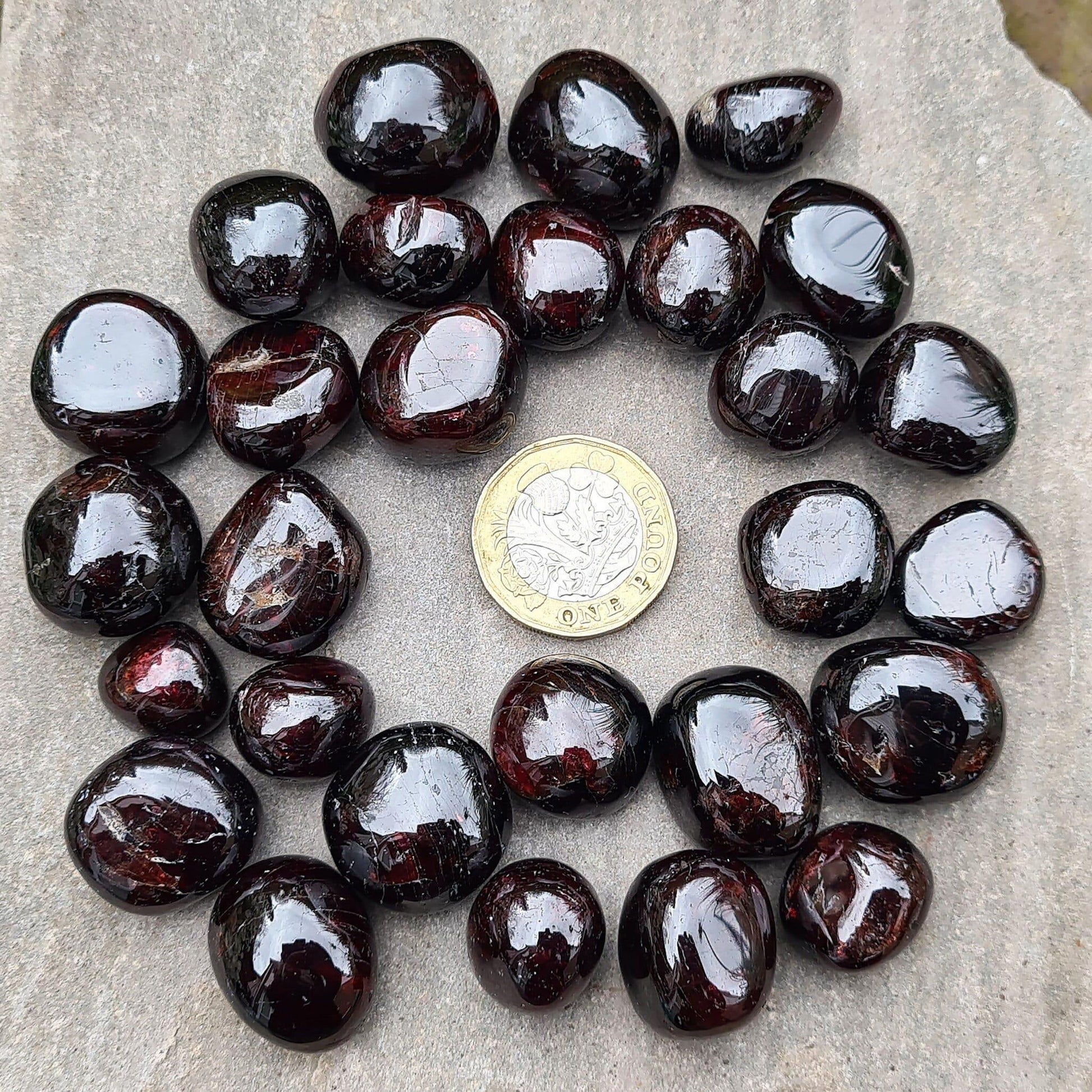 Shop polished Red Garnet crystals from India — deep redbtumbled stones, 8–15gm. Root chakra crystal for courage and motivation, love and passion.