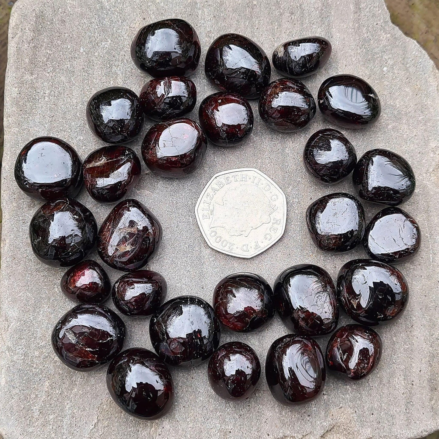 Shop polished Red Garnet crystals from India — deep redbtumbled stones, 8–15gm. Root chakra crystal for courage and motivation, love and passion.