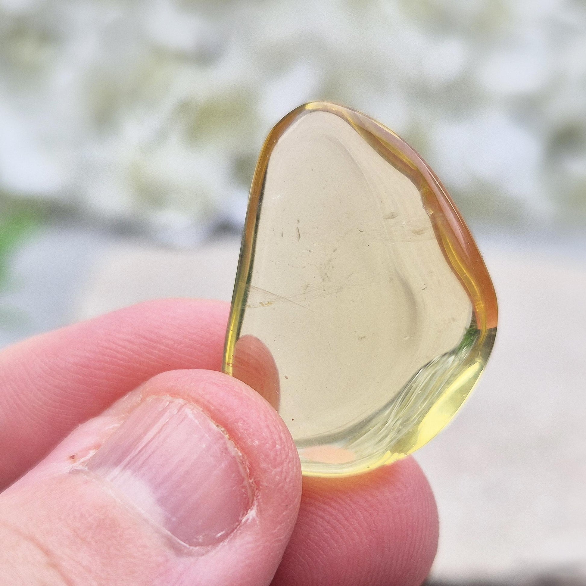 Ouro Verde Quartz tumblestone with olive-green tone. Treated crystal from Brazil for protection, clarity, and personal strength. 