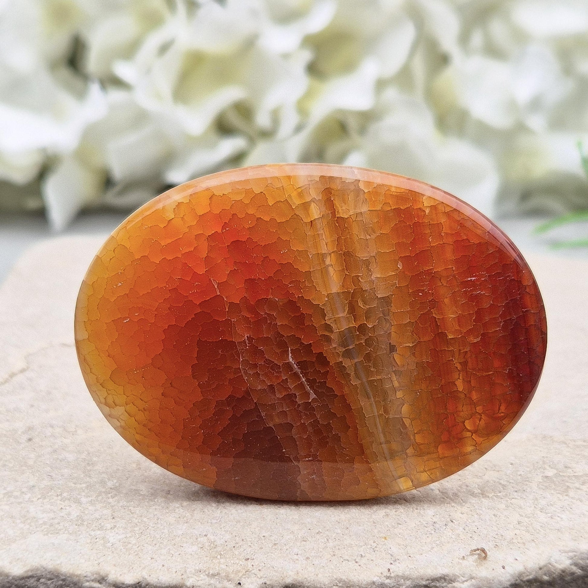 Fire Agate palmstone from Mexico – grounding and protective energy. A calming crystal that boosts vitality, confidence, and inner strength. 