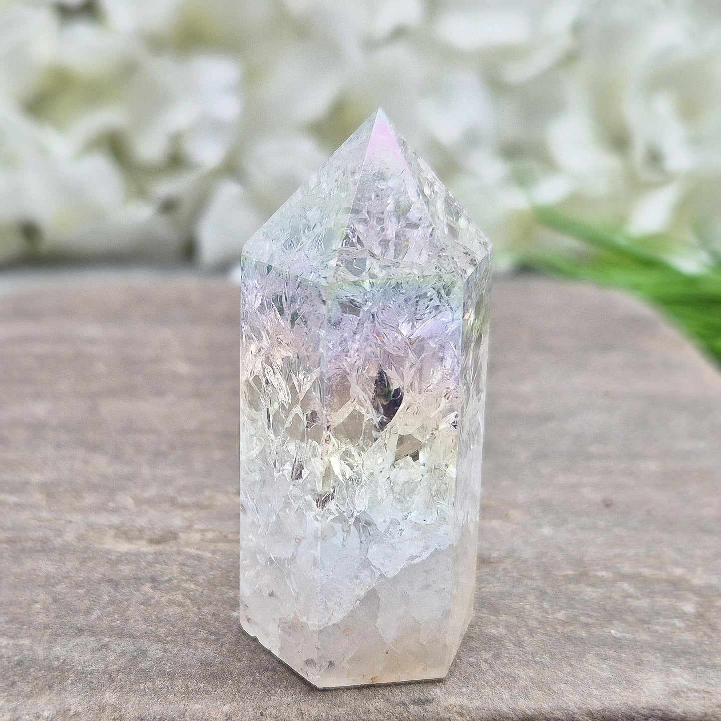 Fire and Ice Aura Quartz with internal rainbow fracturing. A polished crystal for display, positive energy, focus, and meditation.