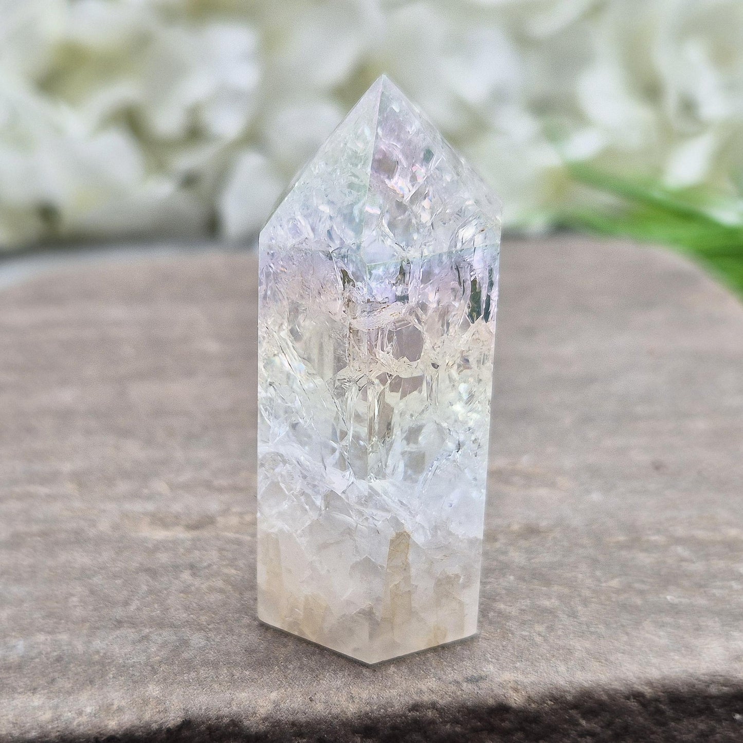 Fire and Ice Aura Quartz with internal rainbow fracturing. A polished crystal for display, positive energy, focus, and meditation.