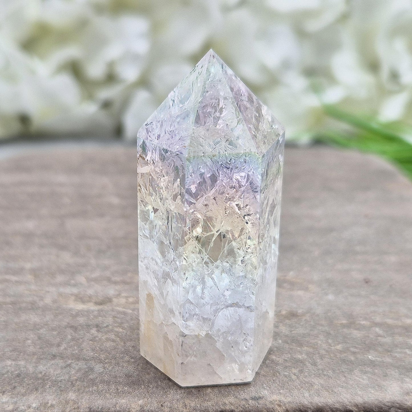 Fire and Ice Aura Quartz with internal rainbow fracturing. A polished crystal for display, positive energy, focus, and meditation.