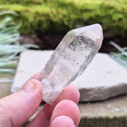 Starbrary Quartz crystal point: a rare crystal with mystical etchings, perfect for energy work, meditation, and enhancing spiritual connection.