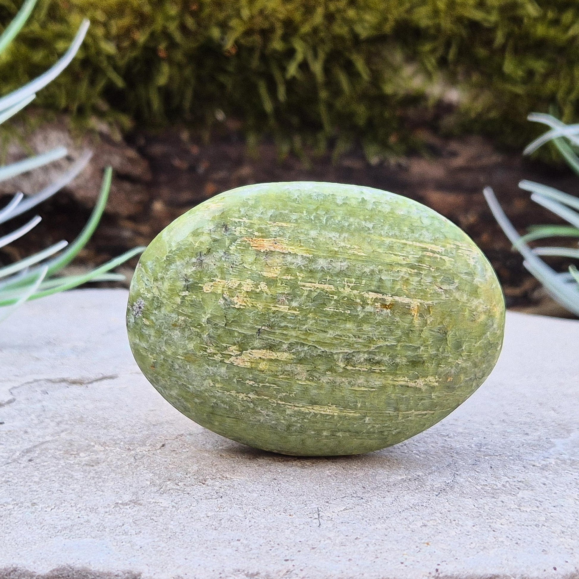 Tremolite palm stone – A polished crystal, perfect for mindful practices, promoting tranquility, and adding a serene touch to any space.