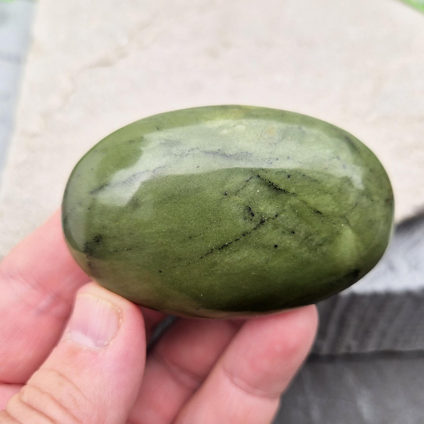 Nephrite Jade palm stone for calm, protection, and emotional balance. A soothing crystal to ease stress and support the heart. 