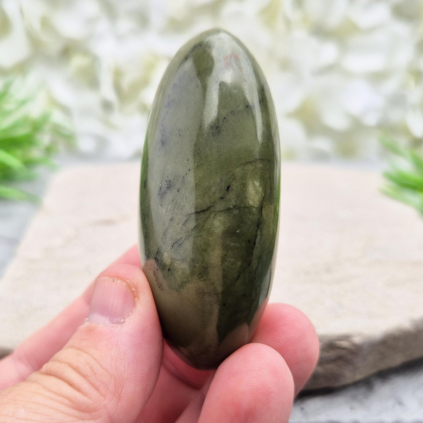 Nephrite Jade palm stone for calm, protection, and emotional balance. A soothing crystal to ease stress and support the heart. 