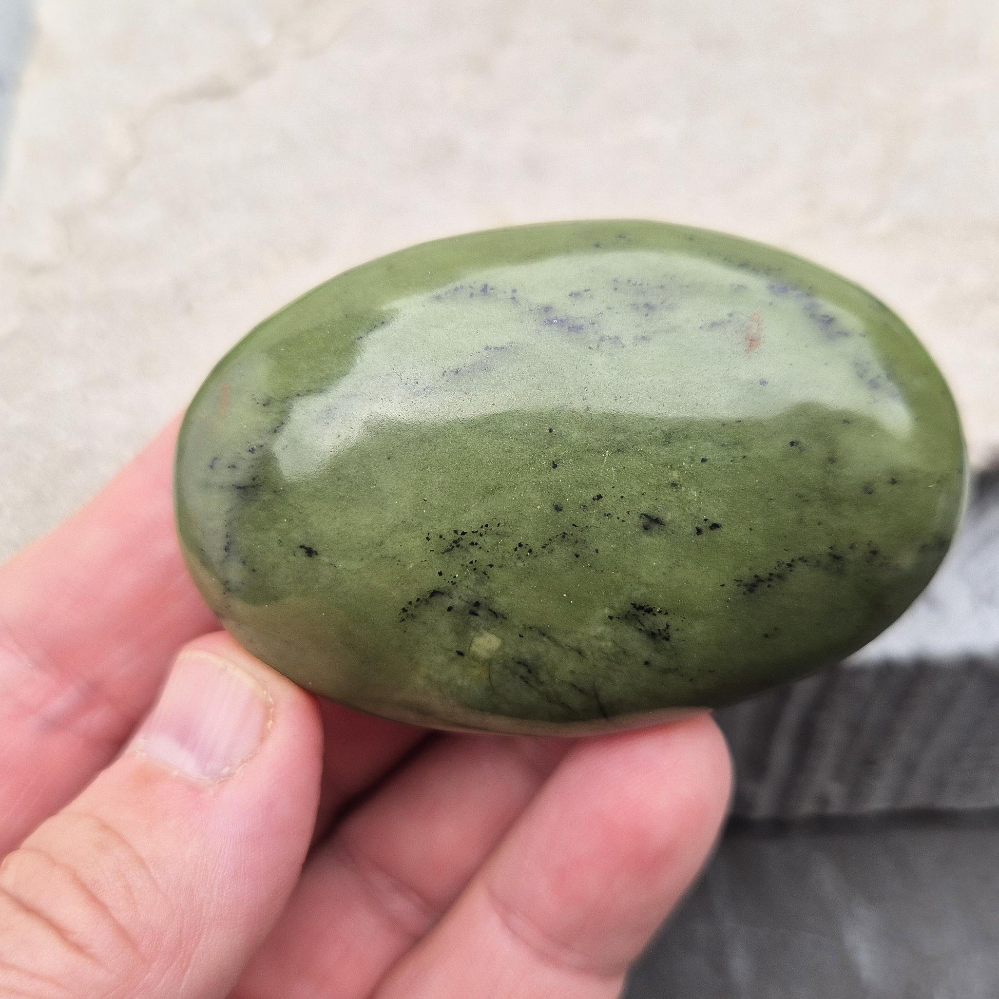 Nephrite Jade palm stone for calm, protection, and emotional balance. A soothing crystal to ease stress and support the heart. 