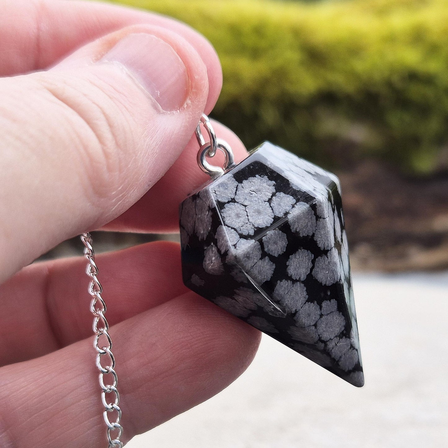 snowflake Obsidian Pendulum – Promotes balance, clears negativity, and supports inner reflection. Ideal for divination and grounding energy work.