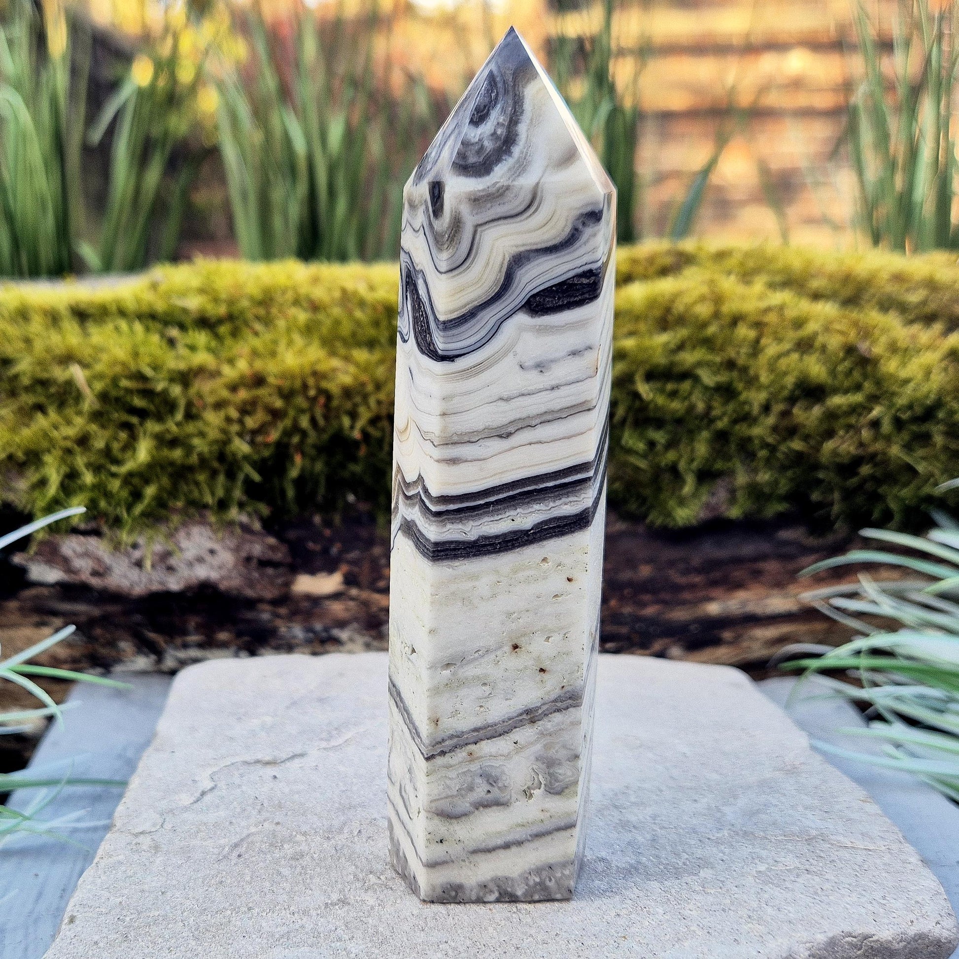 Zebra Calcite Point – Encourages self-awareness, clarity, and calm. A powerful tool for growth, balance, and emotional strength.