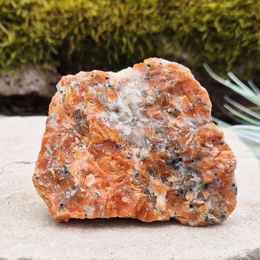 Orchid Calcite Crystal – a natural blend of Orange Calcite and Black Tourmaline. Perfect for adding energy and style to your home or workspace.