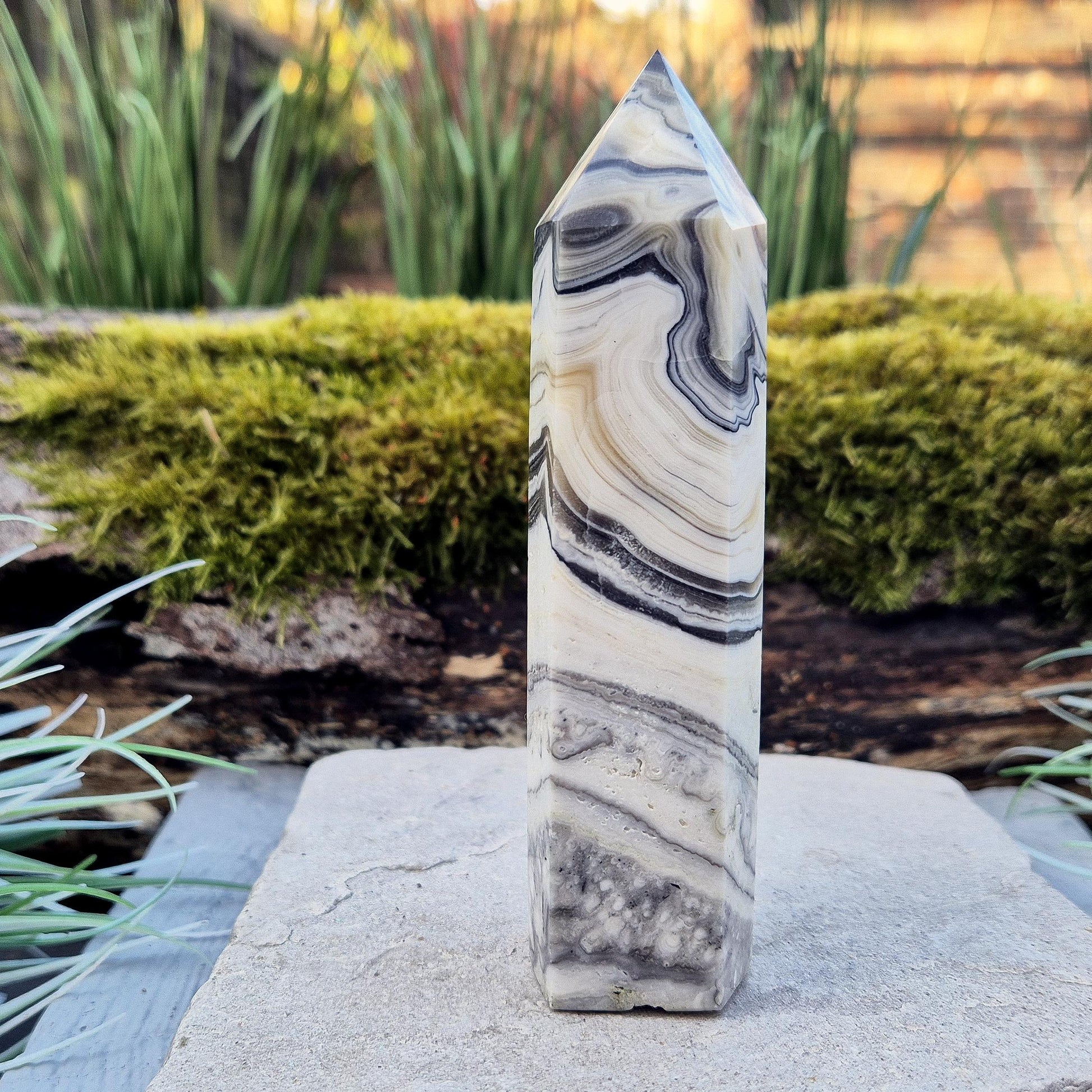 Zebra Calcite Point – Encourages self-awareness, clarity, and calm. A powerful tool for growth, balance, and emotional strength.
