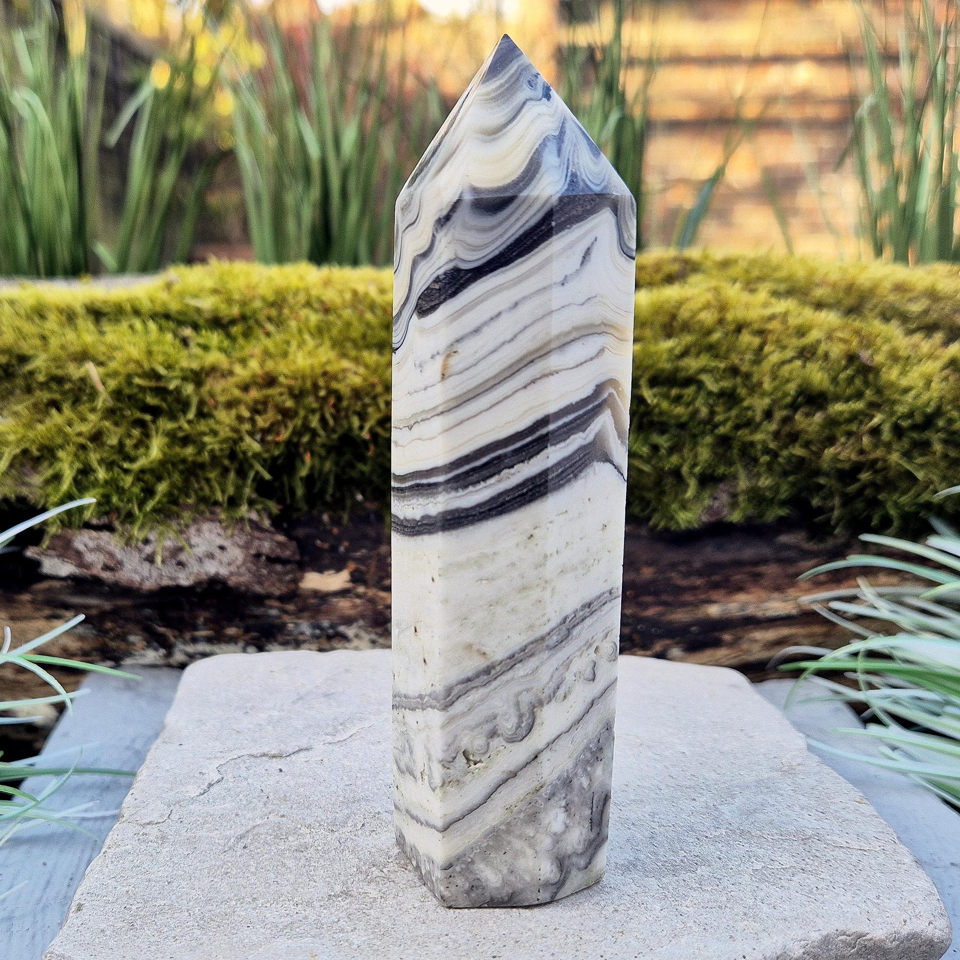Zebra Calcite Point – Encourages self-awareness, clarity, and calm. A powerful tool for growth, balance, and emotional strength.