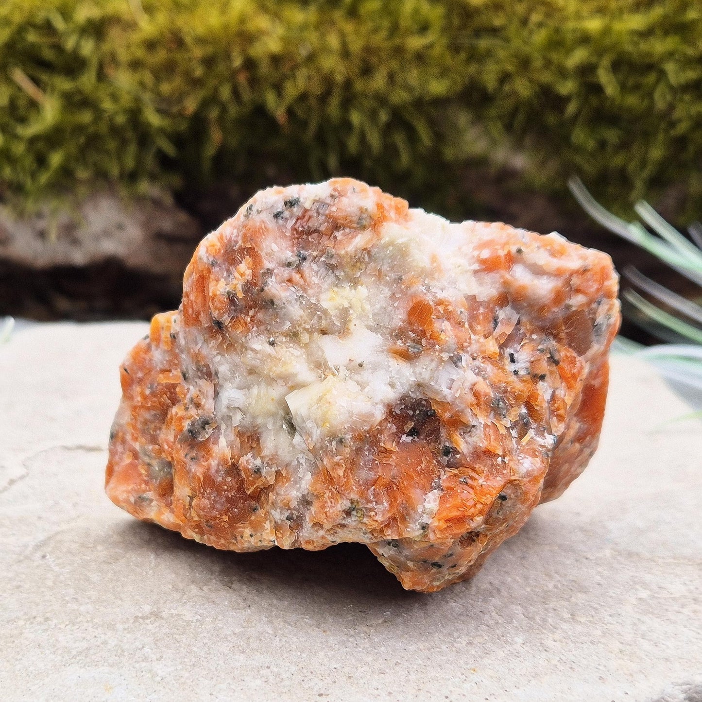 Orchid Calcite Crystal – a natural blend of Orange Calcite and Black Tourmaline. Perfect for adding energy and style to your home or workspace.