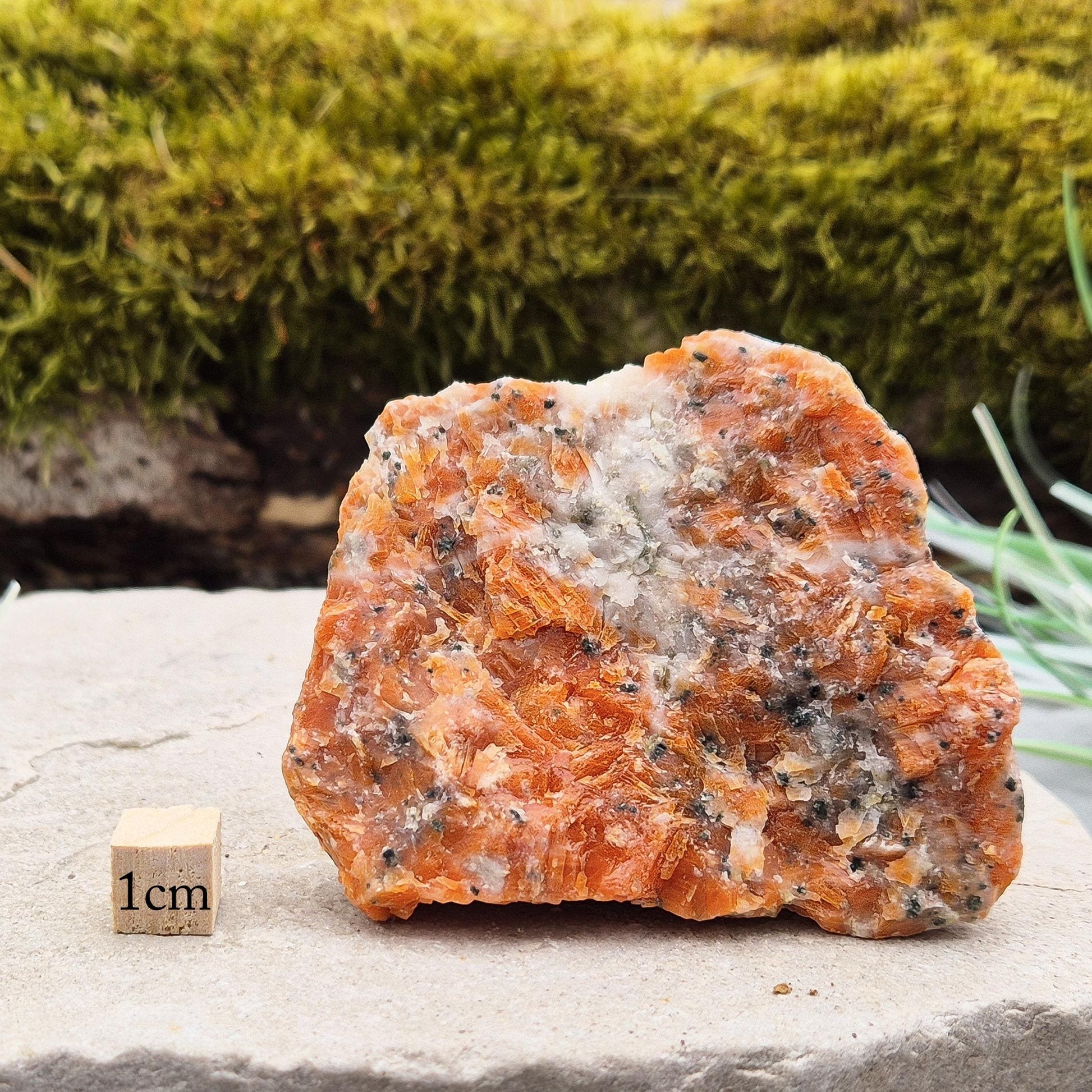 Orchid Calcite Crystal – a natural blend of Orange Calcite and Black Tourmaline. Perfect for adding energy and style to your home or workspace.