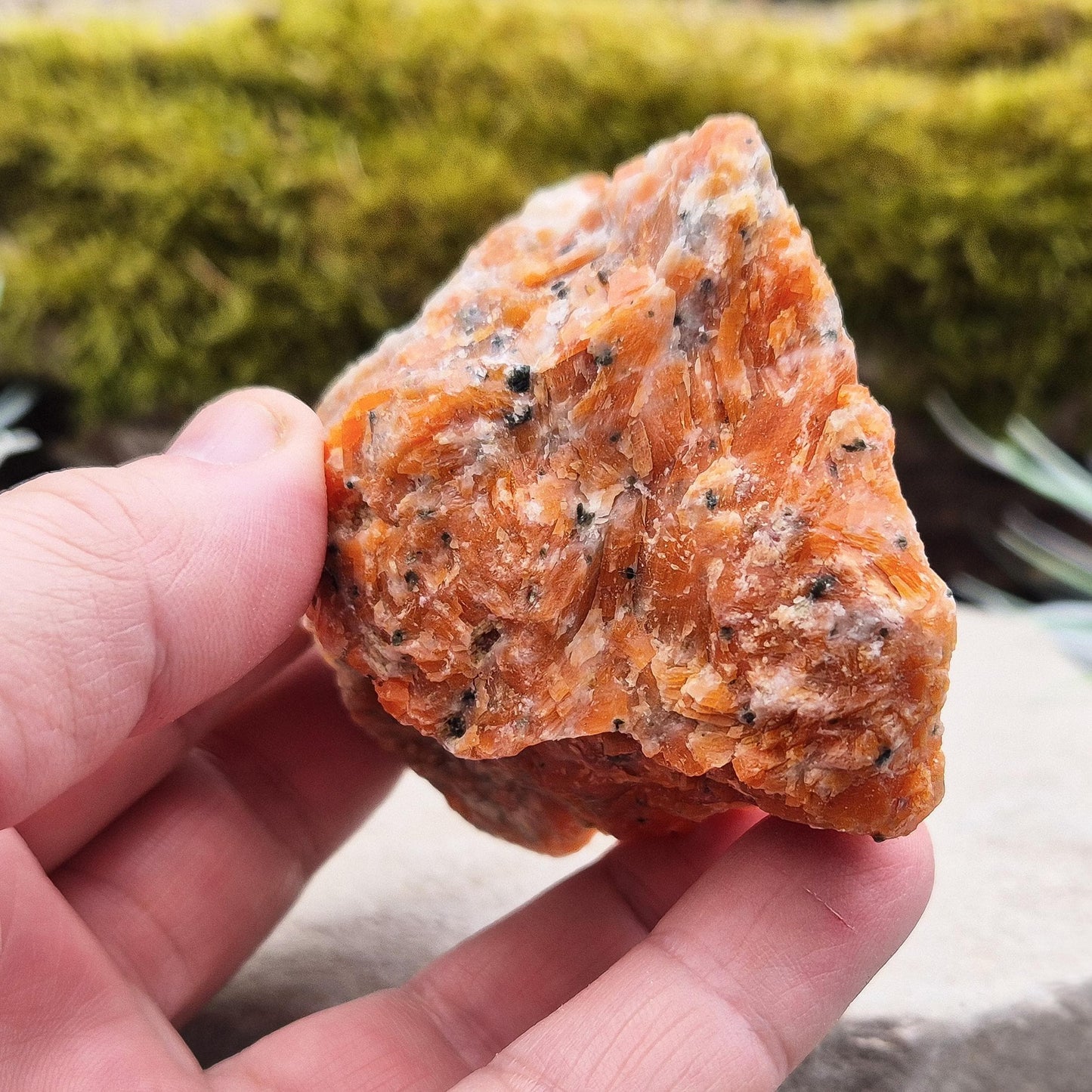 Orchid Calcite Crystal – a natural blend of Orange Calcite and Black Tourmaline. Perfect for adding energy and style to your home or workspace.