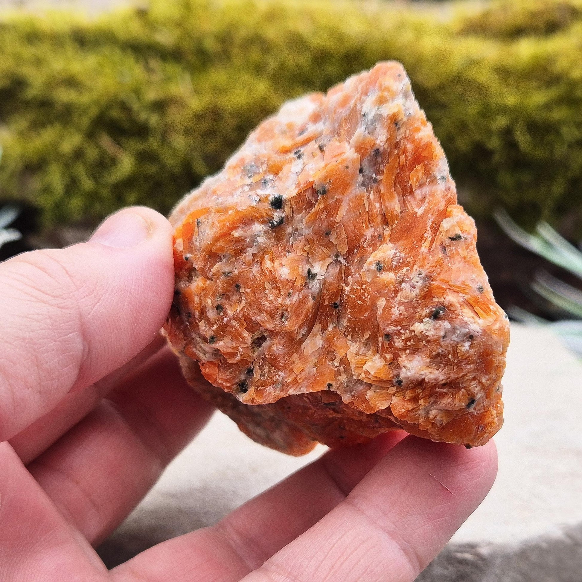 Orchid Calcite Crystal – a natural blend of Orange Calcite and Black Tourmaline. Perfect for adding energy and style to your home or workspace.