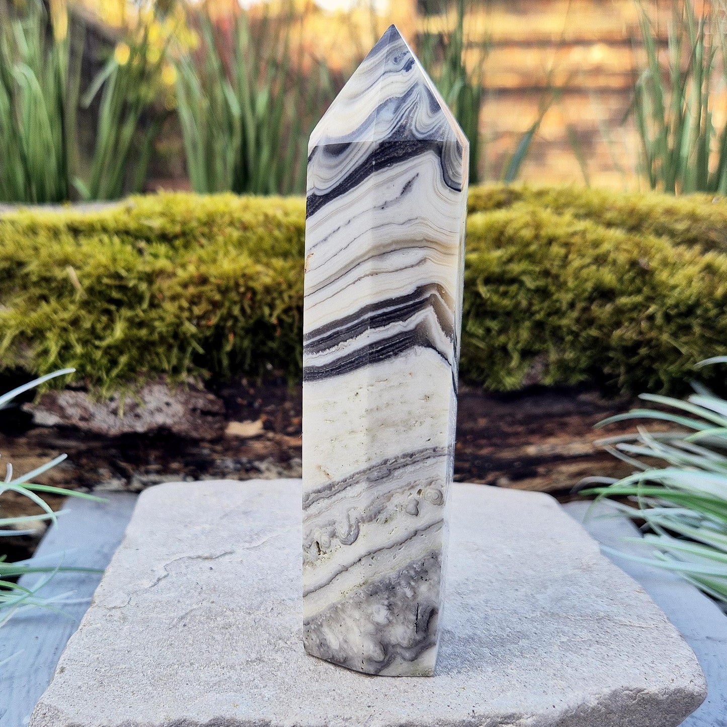 Zebra Calcite Point – Encourages self-awareness, clarity, and calm. A powerful tool for growth, balance, and emotional strength.