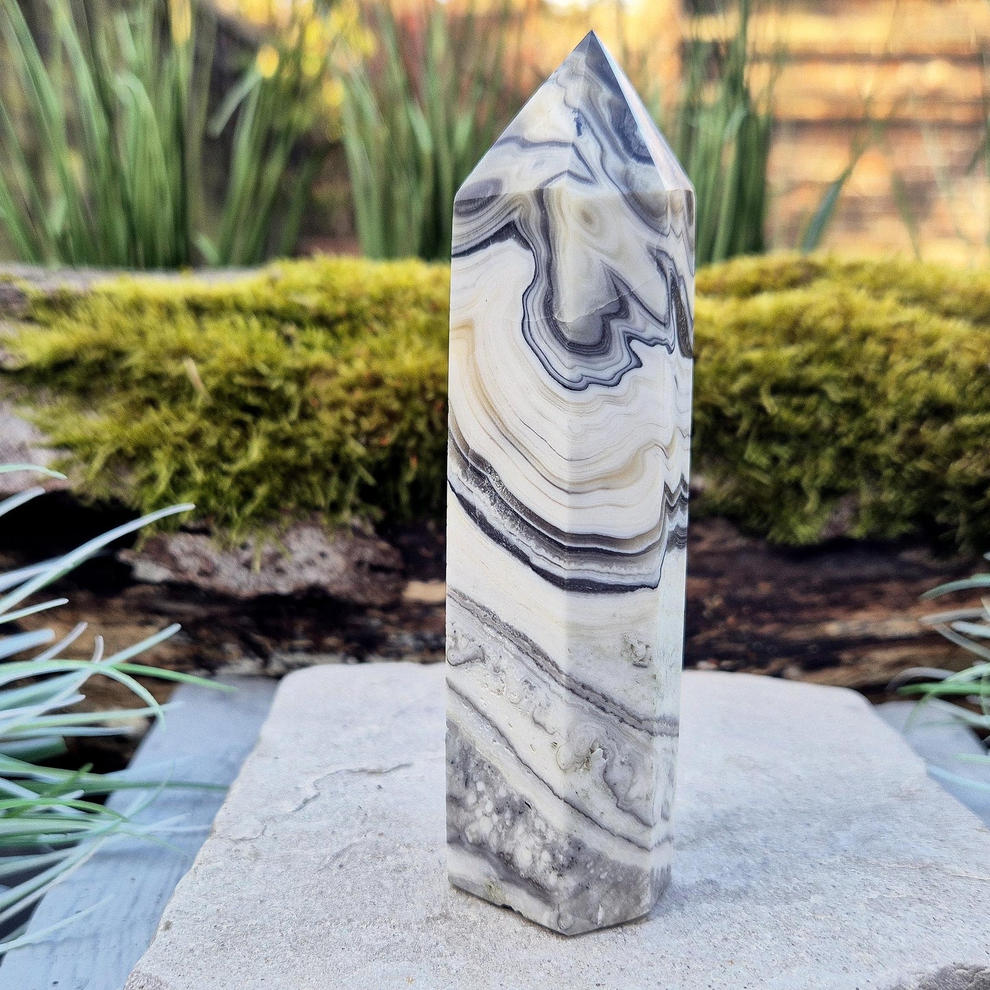 Zebra Calcite Point – Encourages self-awareness, clarity, and calm. A powerful tool for growth, balance, and emotional strength.