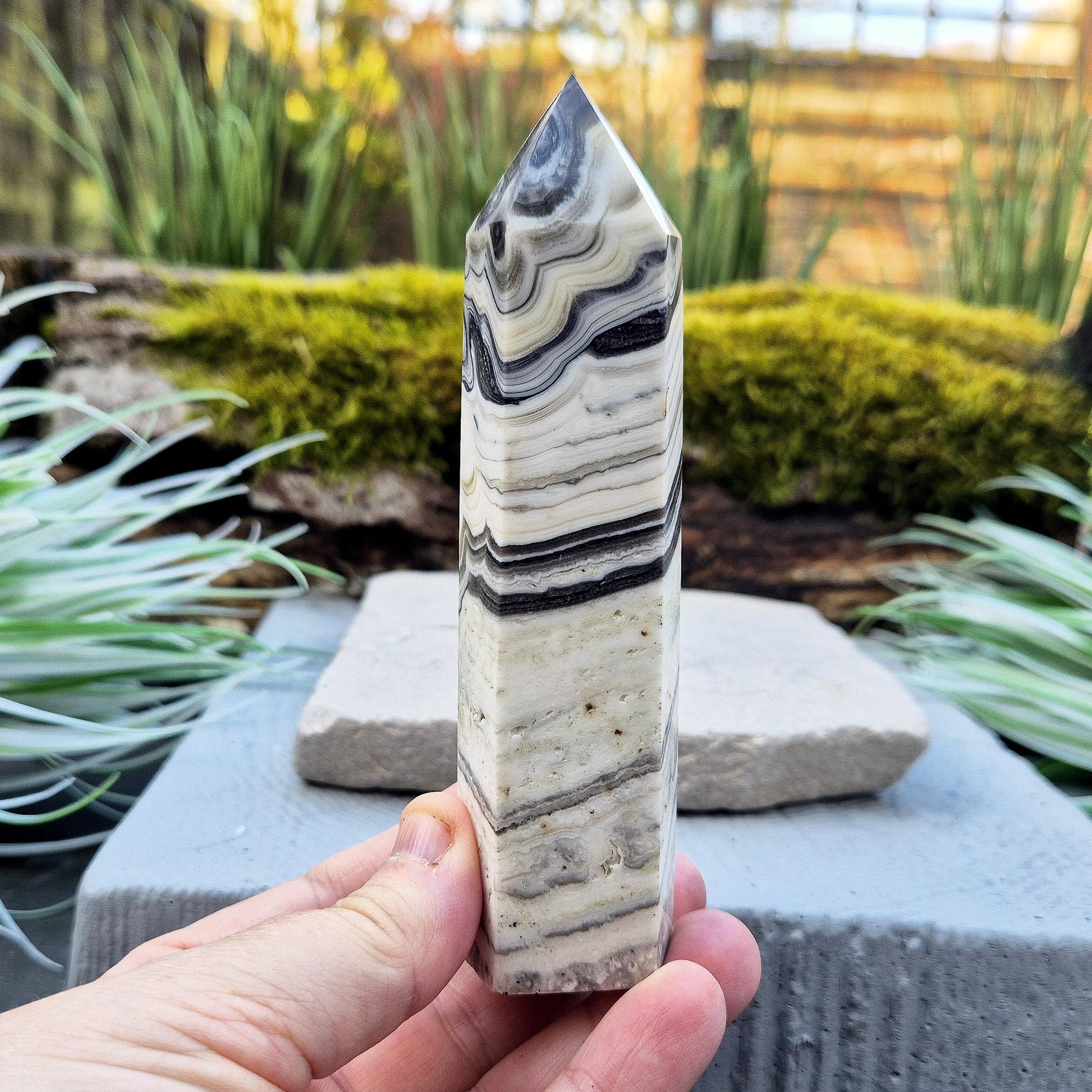 Zebra Calcite Point – Encourages self-awareness, clarity, and calm. A powerful tool for growth, balance, and emotional strength.