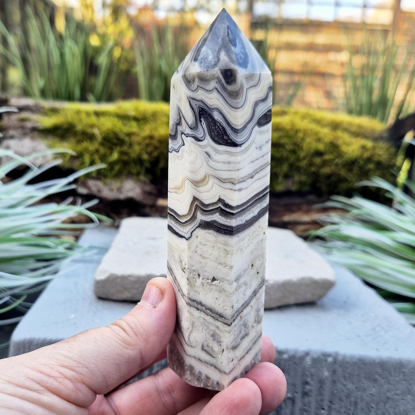 Zebra Calcite Point – Encourages self-awareness, clarity, and calm. A powerful tool for growth, balance, and emotional strength.