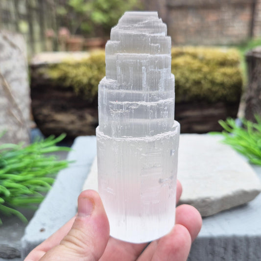Selenite crystal tower for energy cleansing, clarity, and calm. A striking, high-vibe piece to purify spaces and raise your spiritual frequency.
