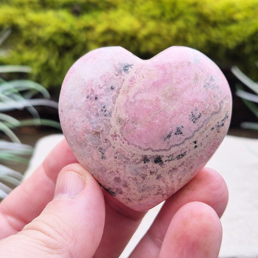 Pink Rhodonite Heart Shaped crystal – Encourages love, forgiveness, and emotional balance while supporting personal growth, compassion, and healing.