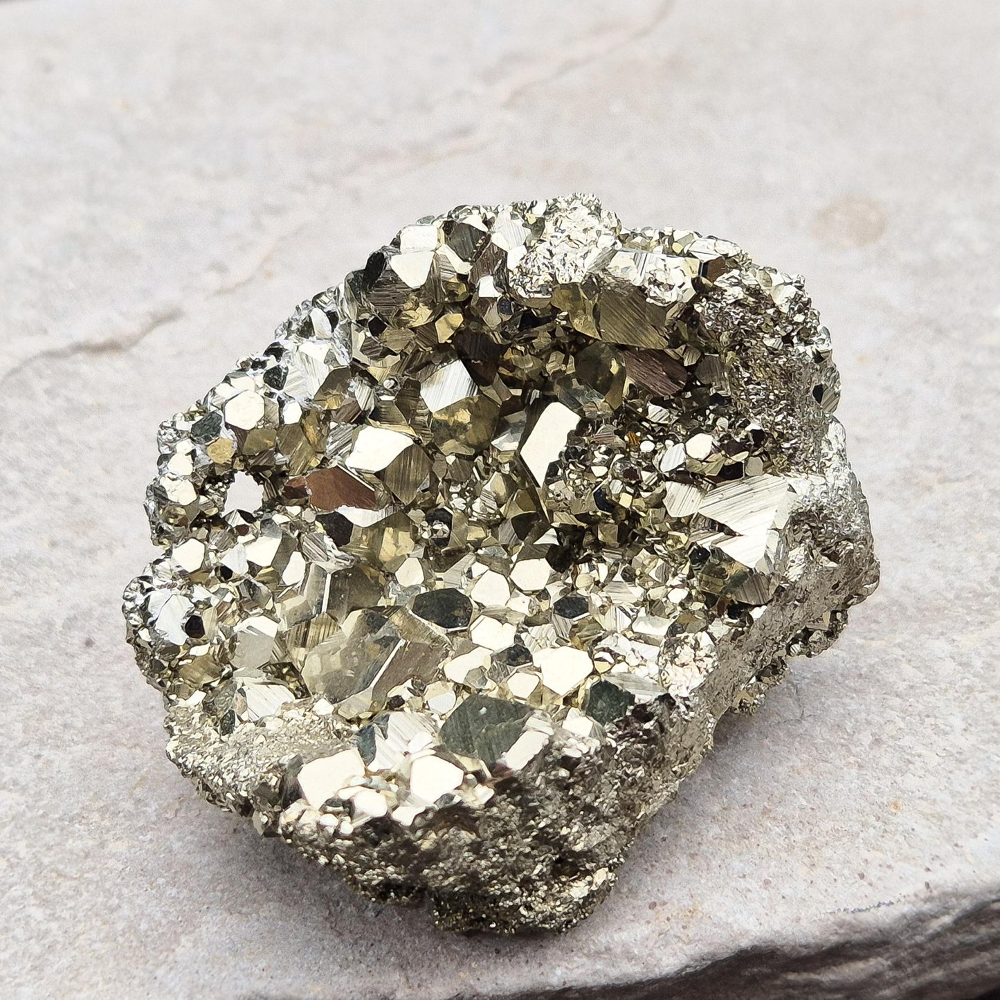 Shop our stunning cubic Pyrite cluster, known for its grounding energy and creative inspiration. Perfect for collectors and crystal enthusiasts.
