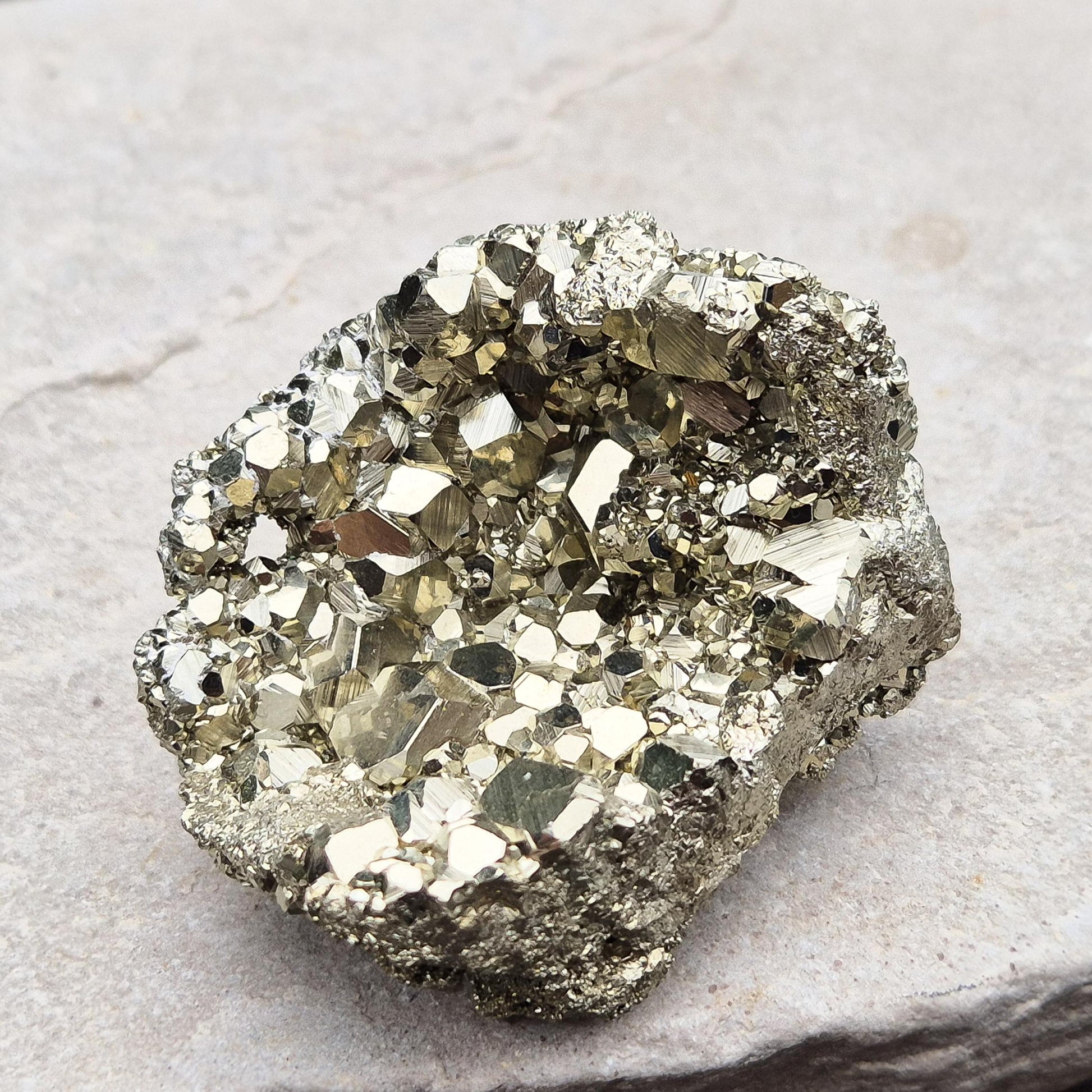 Shop our stunning cubic Pyrite cluster, known for its grounding energy and creative inspiration. Perfect for collectors and crystal enthusiasts.