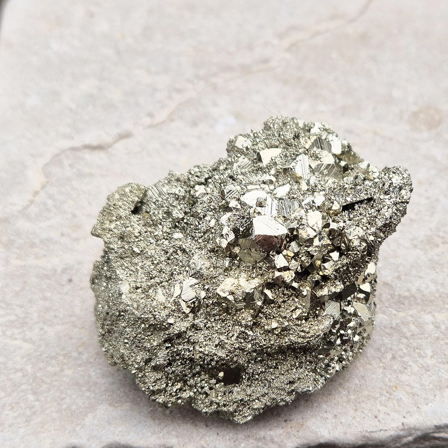 Shop our stunning cubic Pyrite cluster, known for its grounding energy and creative inspiration. Perfect for collectors and crystal enthusiasts.
